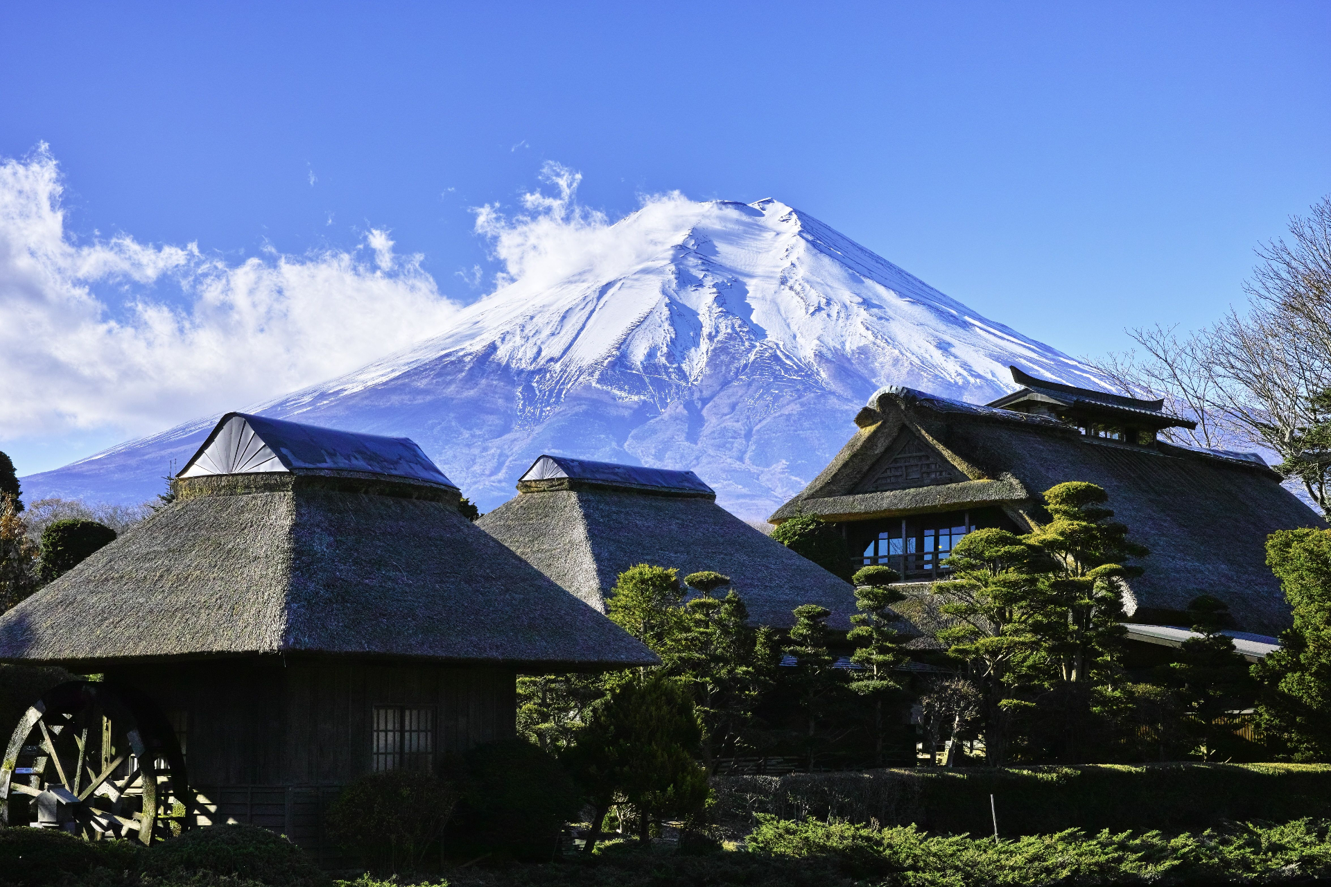 Mount Fuji rising above a traditional Japanese village